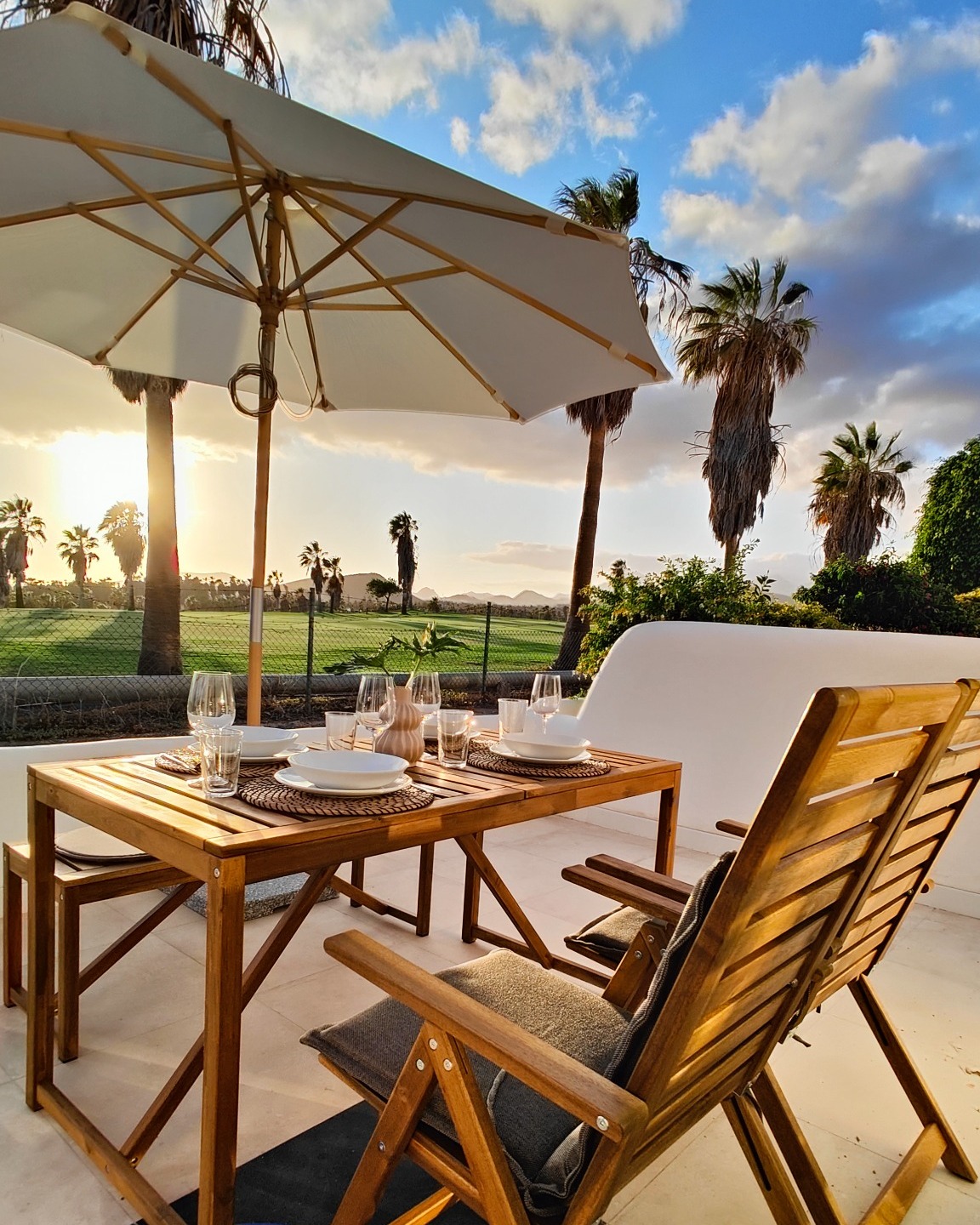 Terrace dining area at sunset in Tenerife Golf & Ocean Apartment